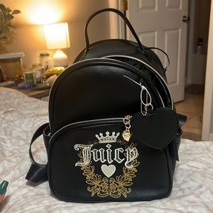 Juicy mini backpack/ purse. Brand new. Never used. I bought a bigger one.